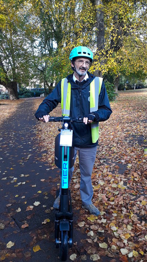 Cllr D'Agorne riding a scooter